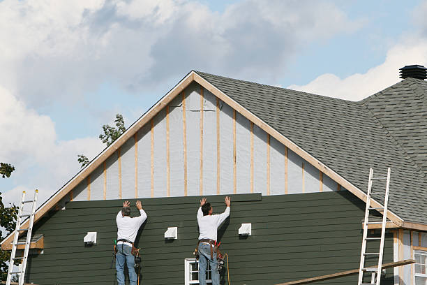 Professional Siding technician working in Richland, GA